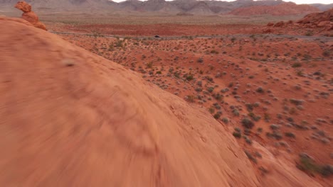 Valley-of-Fire-high-speed-fpv-aerial-approaching-car