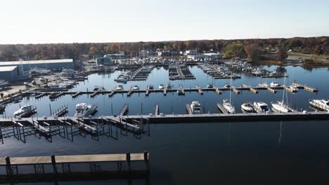 Sideways-motion,-tracking-the-calm-water-near-a-half-empty-Marina-close-to-Winter