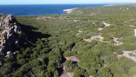 Aerial-drone-flyes-forward-in-paradisiac-island-of-Sant'Antioco-coastline