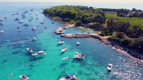 Flying-around-the-port-of-Saint-Honorat-island-part-of-the-Iles-de-Lérins,-next-to-Cannes-in-south-of-France