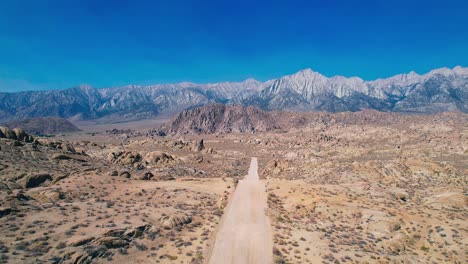 Alabama-Hills-in-Lone-Pine-California-4k-Drone-Footage-Forward-Push-Over-Movie-Road-with-Mount-Whitney-in-the-Background