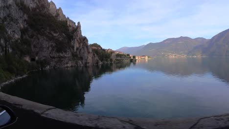 filming-the-panorama-driving-on-the-shore-narrow-road-of-iseo-lake-with-a-tesla