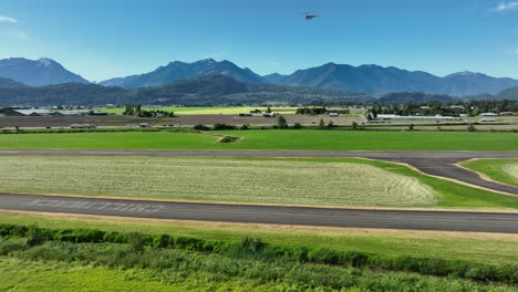 Airport-Road-Of-Chilliwack-Municipal-Airport-In-British-Columbia,-Canada---aerial-drone-shot