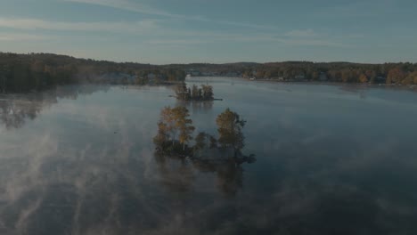 Flying-over-islands-on-Moosehead-Lake-surrounded-by-morning-mist