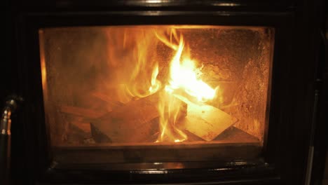 Lit-wood-burning-stove-burning-kindling