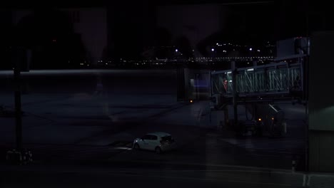 Airport-Air-Strip-at-night-with-reflection-on-the-window