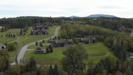 Aerial-view-of-summer-homes-on-the-hillsides-of-Rangeley,-Lake-in-ruralMaine