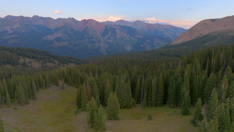 Aerial-of-mountains-in-the-Colorado-Rockies-with-a-boom-down-towards-the-trees-and-hiking-trail-below