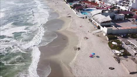 Beautiful-drone-shot-of-the-beach-and-beach-houses-in-Punta-Hermosa-Peru