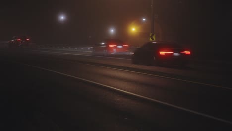 Cars-Driving-In-Foggy-Highway-At-Night---wide