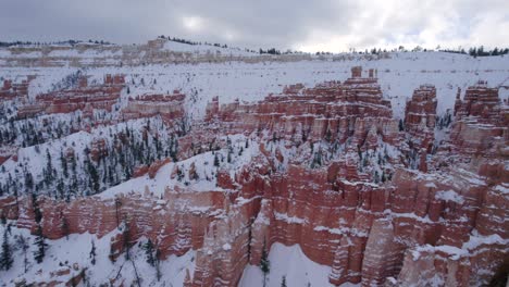 Aerial-4K-footage-of-Bryce-Canyon-National-Park-covered-in-snow-in-Utah,-USA