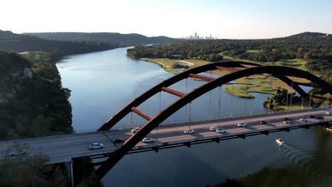 Aerial-drone-shot-overlooking-Pennyback-bridge-in-Austin,-Texas,-USA-of-Lake-Austin-on-a-sunny-morning
