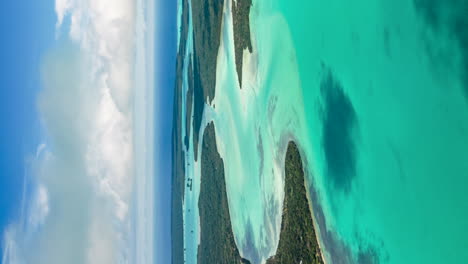 Saint-Maurice-Bay-in-the-Isle-of-Pines-in-a-dreamy,-exotic,-tropical,-paradise---vertical-aerial-hyperlapse