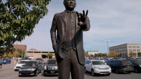 Statue-of-auto-pioneer-Albert-Champion-in-Flint,-Michigan-with-gimbal-video-tilting-up