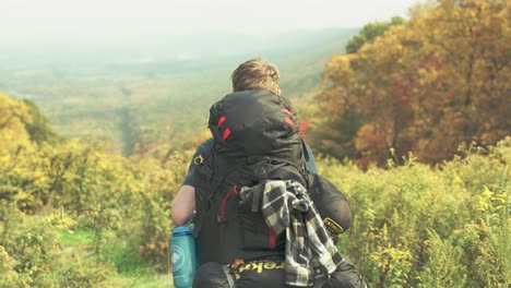 Backpacking-male-at-scenic-overlook-during-fall