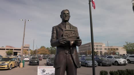 Statue-of-auto-pioneer-David-Buick-in-Flint,-Michigan-with-gimbal-video-moving-forward