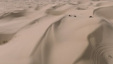 Aerial-Drone-Shot-of-ATV-Sand-Dune-Buggies-Driving-in-California-Desert