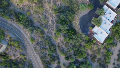 Drone-Shot-of-Home-on-Desert-Landscape-in-Tucson,-Arizona,-Desert-Brush-Below
