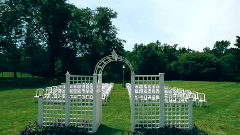 Drone-flying-over-elegant-wedding-setup-at-Garfield-Park-conservatory-of-Indianapolis,-Indiana