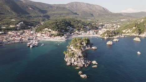 Scenic-resort-town-Parga-on-Ionian-coast,-Epirus,-Greece---aerial-arc