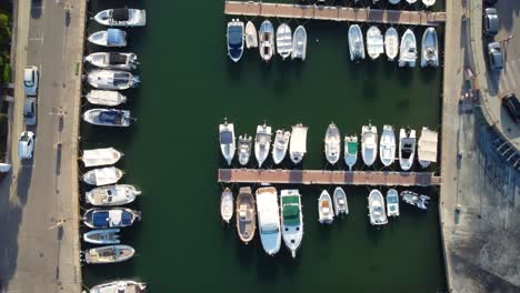 Top-down-view-of-boats-in-harbor-of-Portopetro