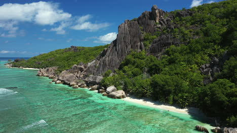 Drone-flying-over-the-ocean-and-rocks-on-La-Digue-Island-in-the-Seychelles