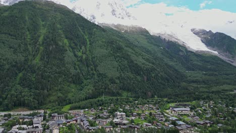 Mont-Blanc-Glacier-and-Chamonix-Village---Aerial-Tilt-Up