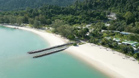 Aerial-drone-shot-of-Empty-Pantai-Kok-Beach-with-big-mountains-and-forest
