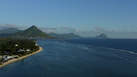 Aerial-View-of-Mauritius-Island-Coastline,-Sandy-Beach-and-Hills-Above-Indian-Ocean,-Drone-Shot