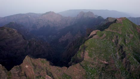Sharp-peaks-of-high-rocky-mountain-range-in-Madeira-in-twilight-haze