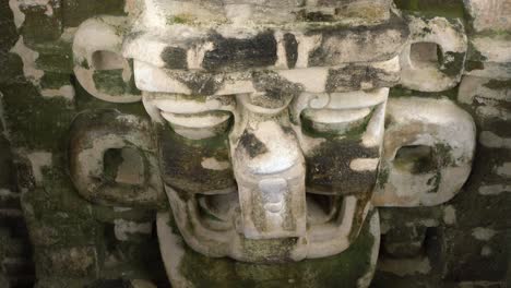 Old-Maya-city-in-Guatemala,-Tikal,-demoniac-mask