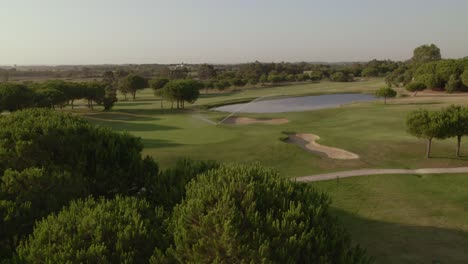 Panoramic-aerial-view-of-lake-in-golf-course