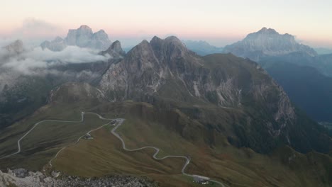 Aerial-shot-of-Passo-Giau-during-sunset,-Monte-Pelmo-in-the-background