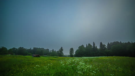 Misty-meadow-clears-up-as-the-sun-rises,-daytime-cloudscape-to-sunset---all-night-and-all-day-long-duration-time-lapse