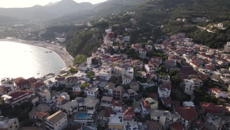 Aerial-over-scenic-seaside-resort-town-Parga---view-of-touristic-Valtos-beach