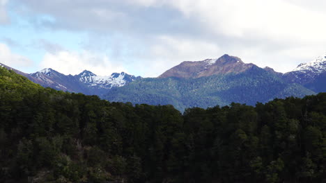 Majestic-mountains-on-shore-of-lake-Manapouri-on-Southern-Island,-New-Zealand