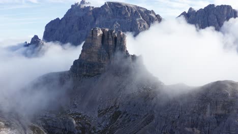Mountain-peak-surrounded-by-clouds,-Torre-Di-Toblin,-Dolomites-Italy