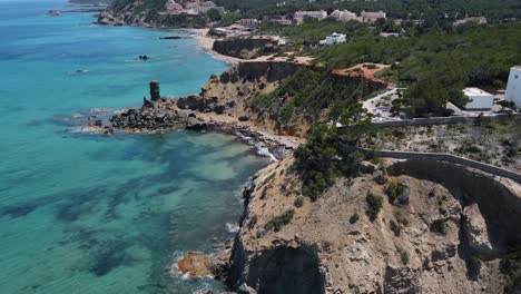 Aerial-View-Of-Rugged-Beach-Coastline-At-Aguas-Blancas-In-Ibiza