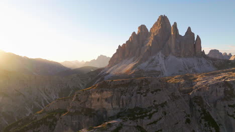 Tre-Cime-South-Tyrol-sunlit-mountain-landscape-aerial-view-across-breath-taking-glowing-sunrise-panorama