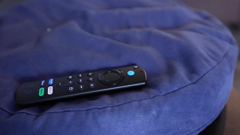 Tv-Remote-on-a-Pillow-on-a-Coffee-Table-in-Tv-Room
