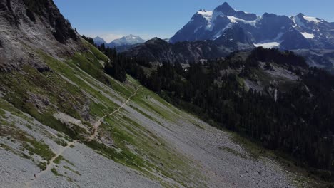 Beautiful-mountain-hiking-trail-drone-backwards