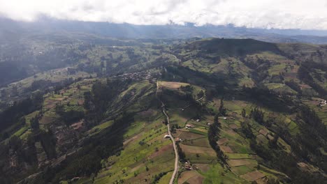 Circling-drone-shot-of-the-vast-green-hills-and-valleys-in-the-peruvian-Andes