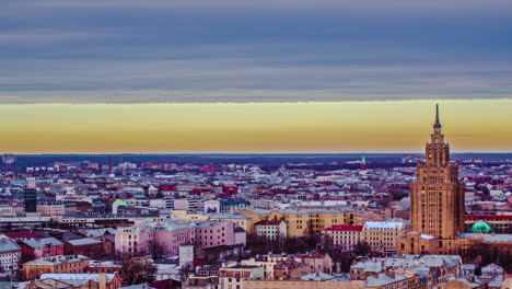 Cloudy-Sunset-Timelapse-Over-The-City-Of-Riga-In-Latvia-With-Towering-Latvian-Academy-Of-Sciences-In-View