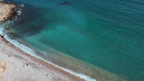 Dreamlike-beach,-stunning-turquoise-water-in-secluded-bay,-Sardinia,-aerial-view