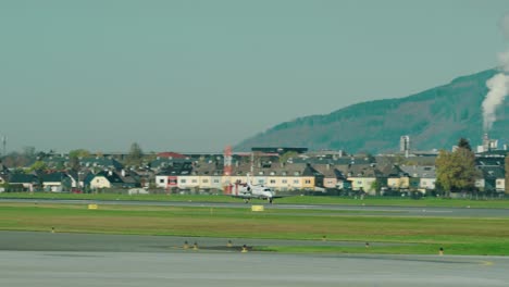 Private-Jet-landing-at-scenic-Austrian-airport-Salzburg-located-within-the-mountains