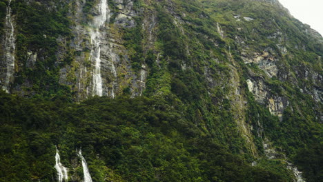 Magnificent-waterfall-in-Doubtful-Sound-fjord,-New-Zealand,-low-angle