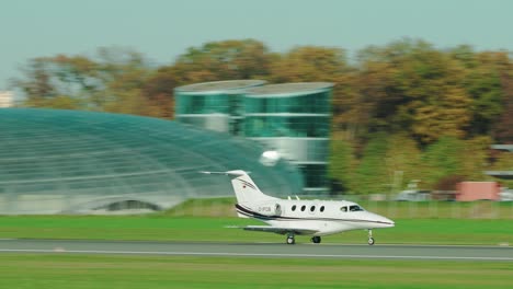 Private-Jet-Beech-390-Premier-landing-at-scenic-Austrian-airport-Salzburg-located-within-the-mountains
