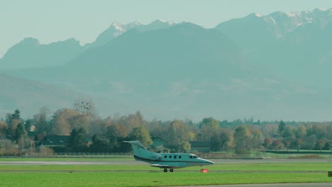 Private-Jet-Beech-390-Premier-taxiing-at-scenic-Austrian-airport-Salzburg-located-within-the-mountains