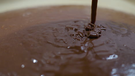 Zooming-on-Pouring-Brownie-Dough-Into-Baking-Tray-Mould-For---Extreme-close-up