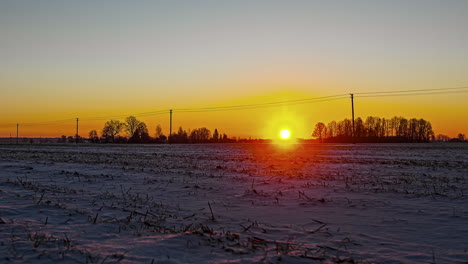 Picturesque-golden-sunrise-at-horizon-on-frozen-winter-morning,time-lapse
